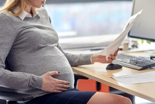 Pregnant employee in an article about pregnancy and harassment policy updates