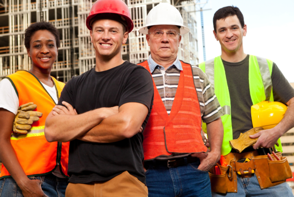 diverse employees in construction uniform in an article about keeping employees happy and retaining them on the team